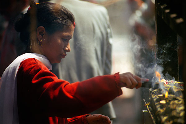 Prayer At Swayambhunath Stupa, Kathmandu, Nepal
