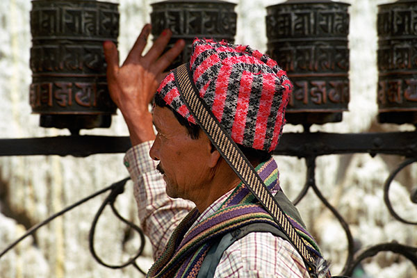 Pilgrim Spinning Prayer Wheels At Swayambhunath Stupa, Kathmandu, Nepal